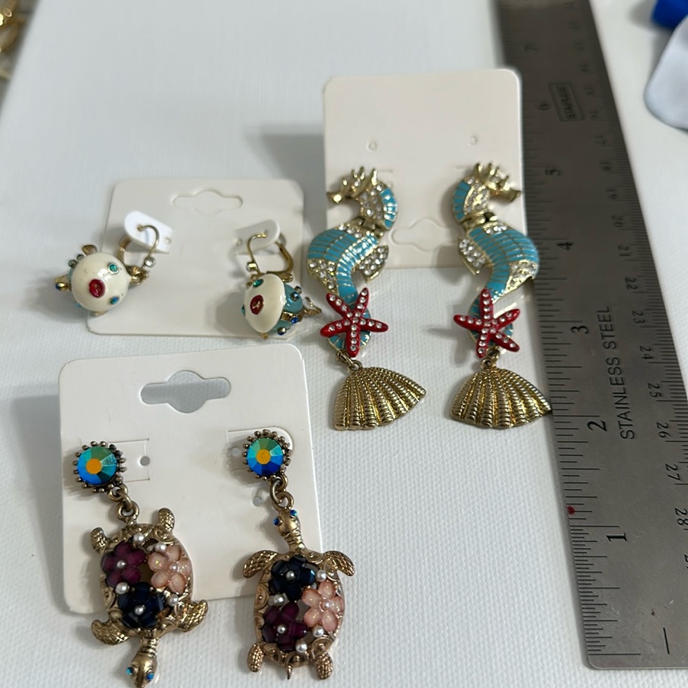 Three pair of earrings, turtle and fish set by Betsey Johnson, worn years ago